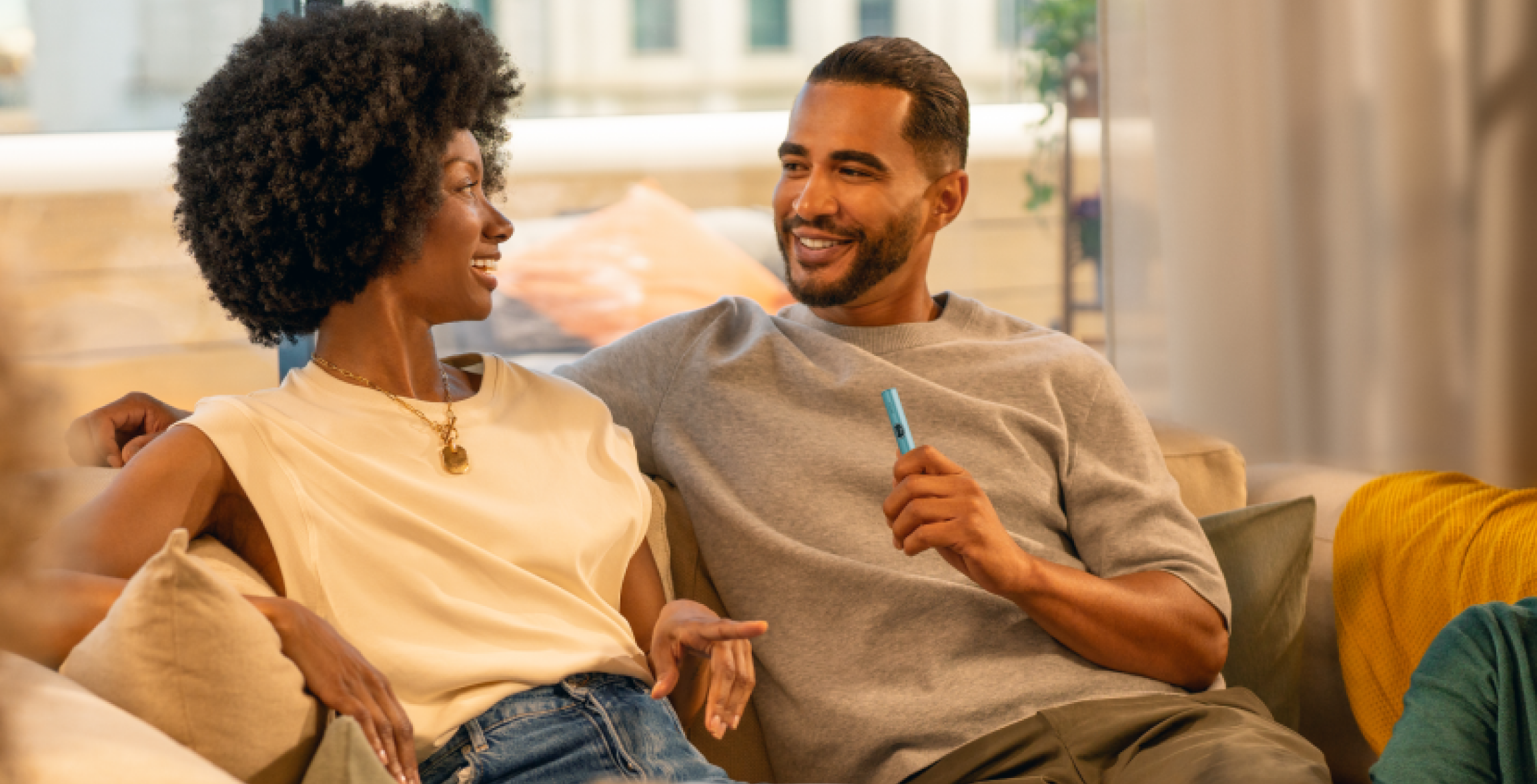 man opening iqos iluma package